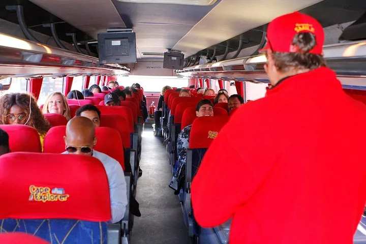 The guide speaking inside the coach